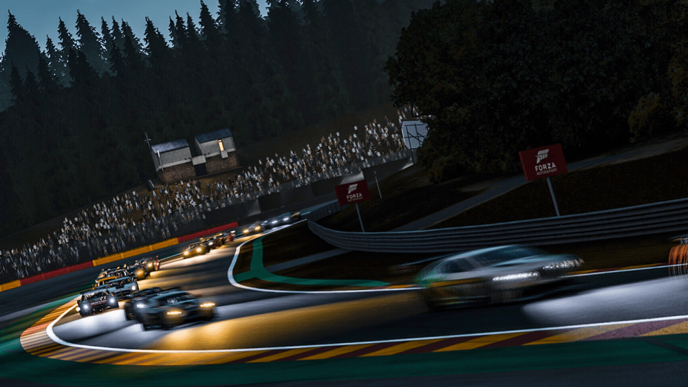 Race cars on track at night from a TORA event in FM7.