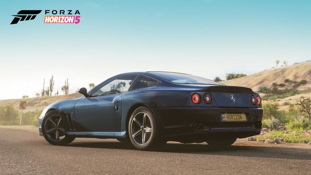 Rear view of dark blue Ferrari 575M Maranello.