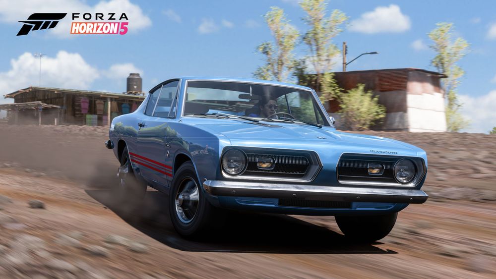 A blue Plymouth Barracuda Formula S kicks up dirt by drifting along the trail.