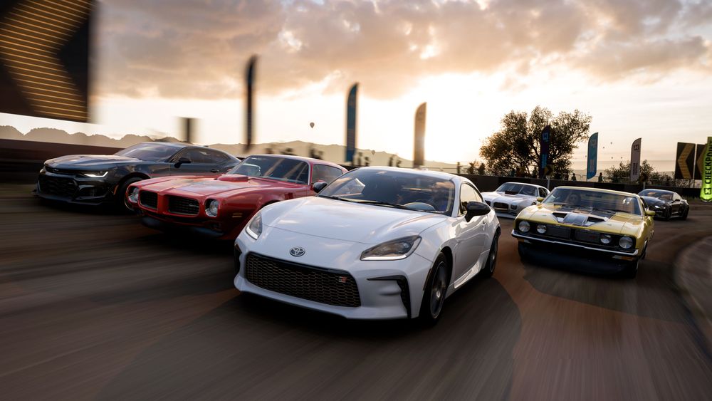 6 cars driving down a road during sunset