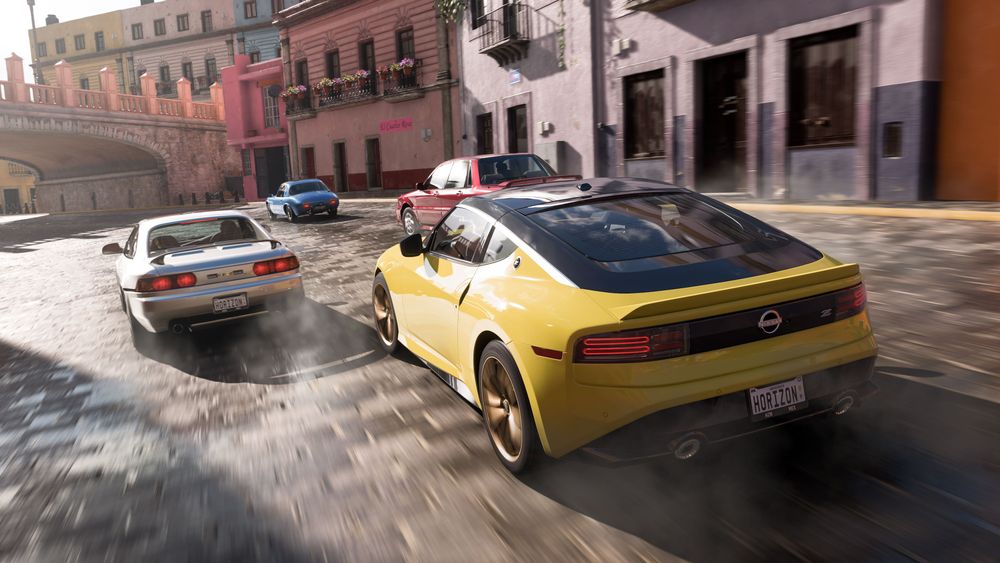 A yellow Nissan Z races through city streets.