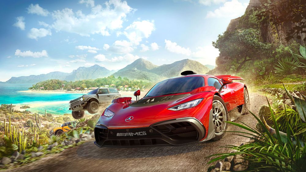 Forza Horizon 5 game cover art featuring red Mercedes-AMG ONE and a pair of Ford Broncos as they drive through the diverse open world landscapes of Mexico featuring green hills, sandy beaches, blue water, cream coloured rocks, a blue sky with white clouds