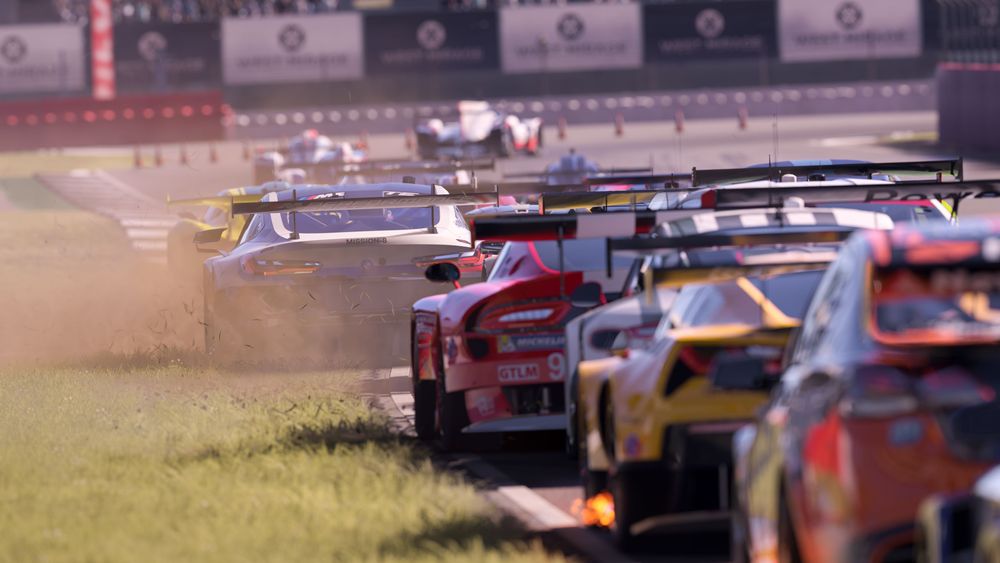 Pack of racecars driving closely together.