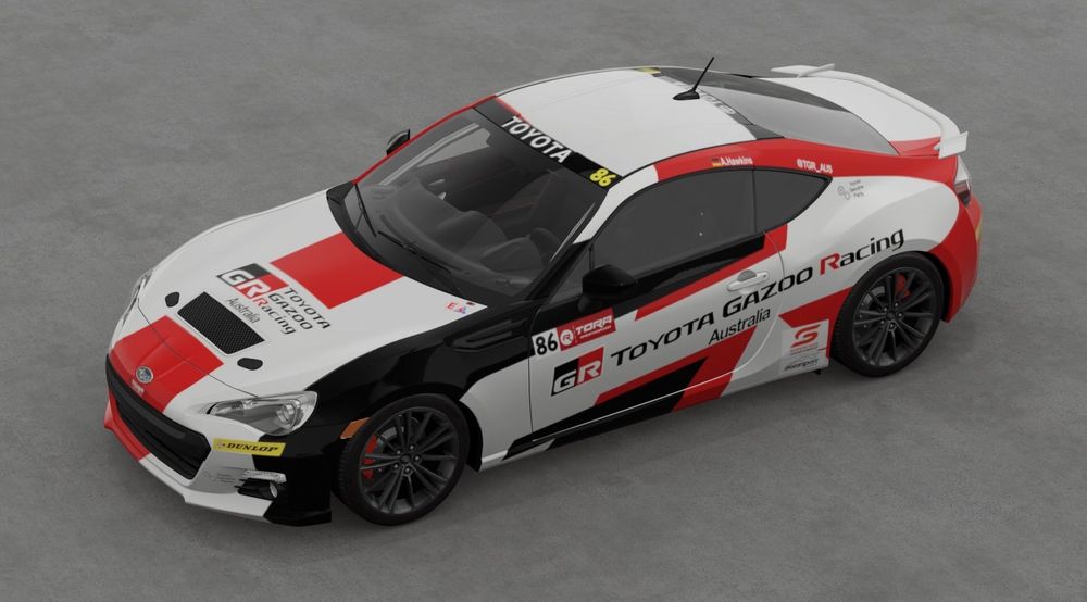 A sports car with red white and black Toyota Gazoo themed livery.