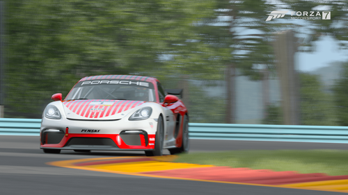 A Porsche race car rounds a corner in FM7.