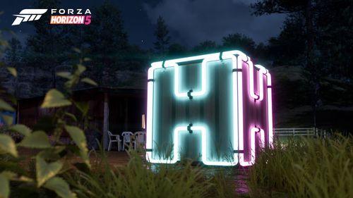 The green and pink 3D Neon Horizon Cube Collectible in a forest at night.