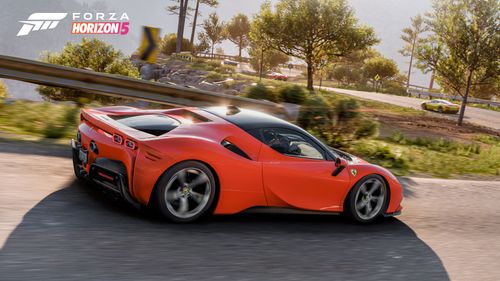 Ferrari SF90 Stradale cruising on a windy road.