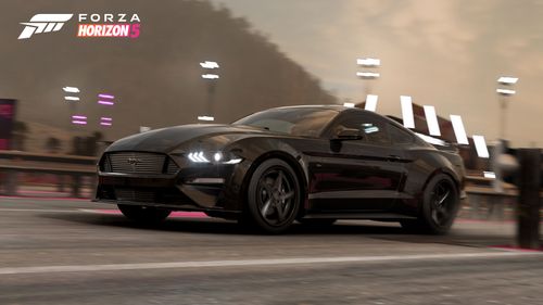 Ford DeBerti Mustang GT passing on a race track