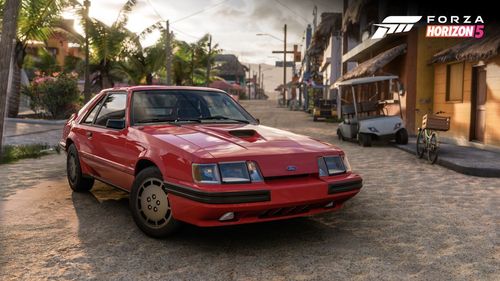 Ford Mustang SVO parked in the sunlight outside.