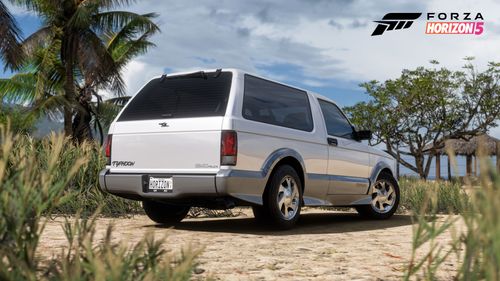 GMC Typhoon parked near a beach