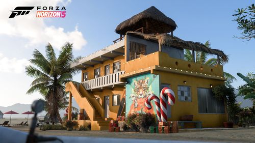 Festive decorations including candy canes at the yellow Player House in Lugar Tanquilo.