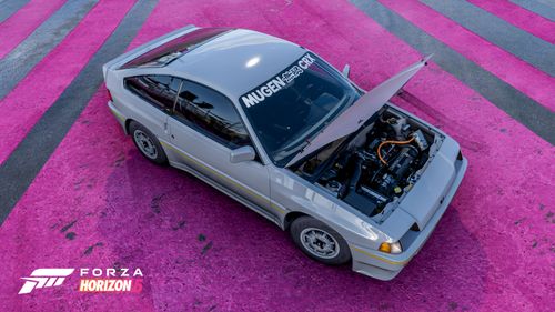 A white Honda CRX Mugen lifts its hood to show off its engine internals on a road with pink stripes.