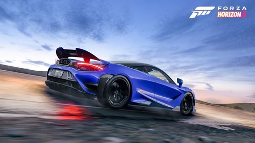 McLaren 765LT Coupe speeding down a rural road.