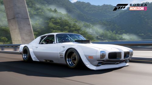 Hot Wheels Pontiac Firebird Transam Custom driving on top of a bridge