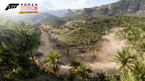 Dusty trails scatter a winding dirt road in the Palm Forest, covered in trees and greenery.
