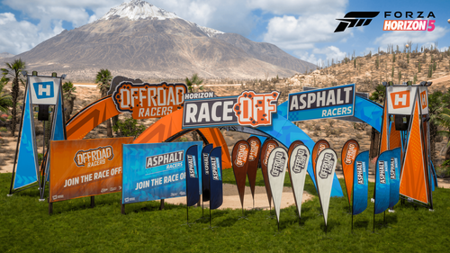 EventLab props featuring flags, barriers, and more placed on a grassy area between mountains