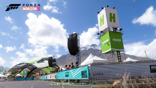 The Horizon Australia Festival Outpost with green, blue and white decorations including tents, fencing and other festival structures.