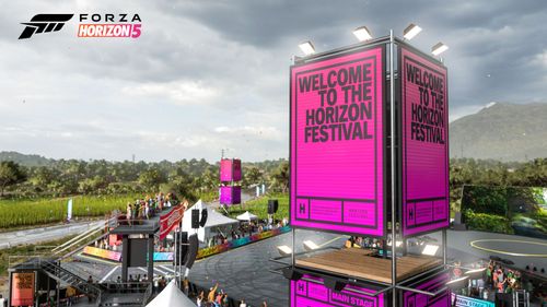 The "Welcome to the Horizon Festival" UK festival box surrounded by other festival decorations and countryside.