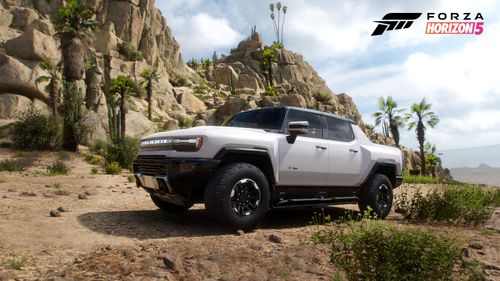 GMC Hummer EV Pickup standing next to a cliff