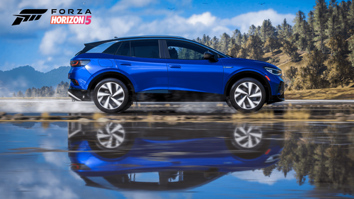 An SUV driving on a wet road. The water underneath it produces a reflection of the car