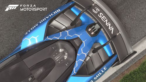 A top view of a McLaren Sena GTR parked on a raceway