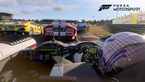 A cockpit view of a racing car on a crammed section battling five others to exit the corner first