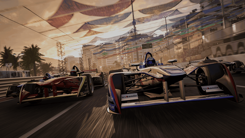 Race cars zooming down a track